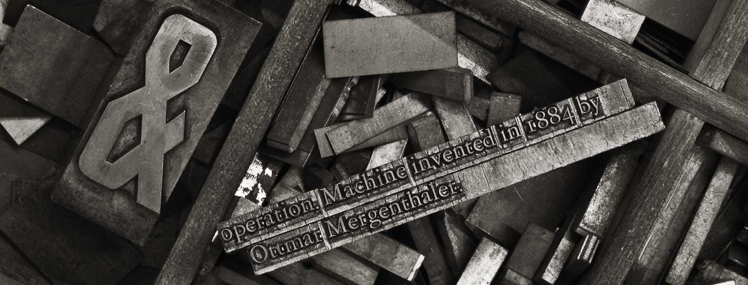 Masthead Graphic: A large ampersand metal type sort set in a square gothic typeface for handset letterpress printing, as well as a couple of cold-cast lines of text set by Linotype machine in ATF Garamond Three.