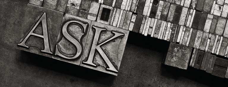Graphic: The word ‘ASK’ set in 60 point Monotype Centaur metal type sorts for handset letterpress printing are arranged in a tray of quads.