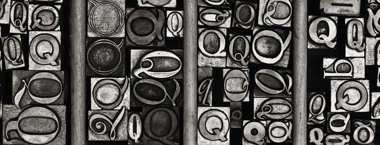 Graphic: A variety of ‘Q’ metal type sorts for handset letterpress printing in a resorting tray.